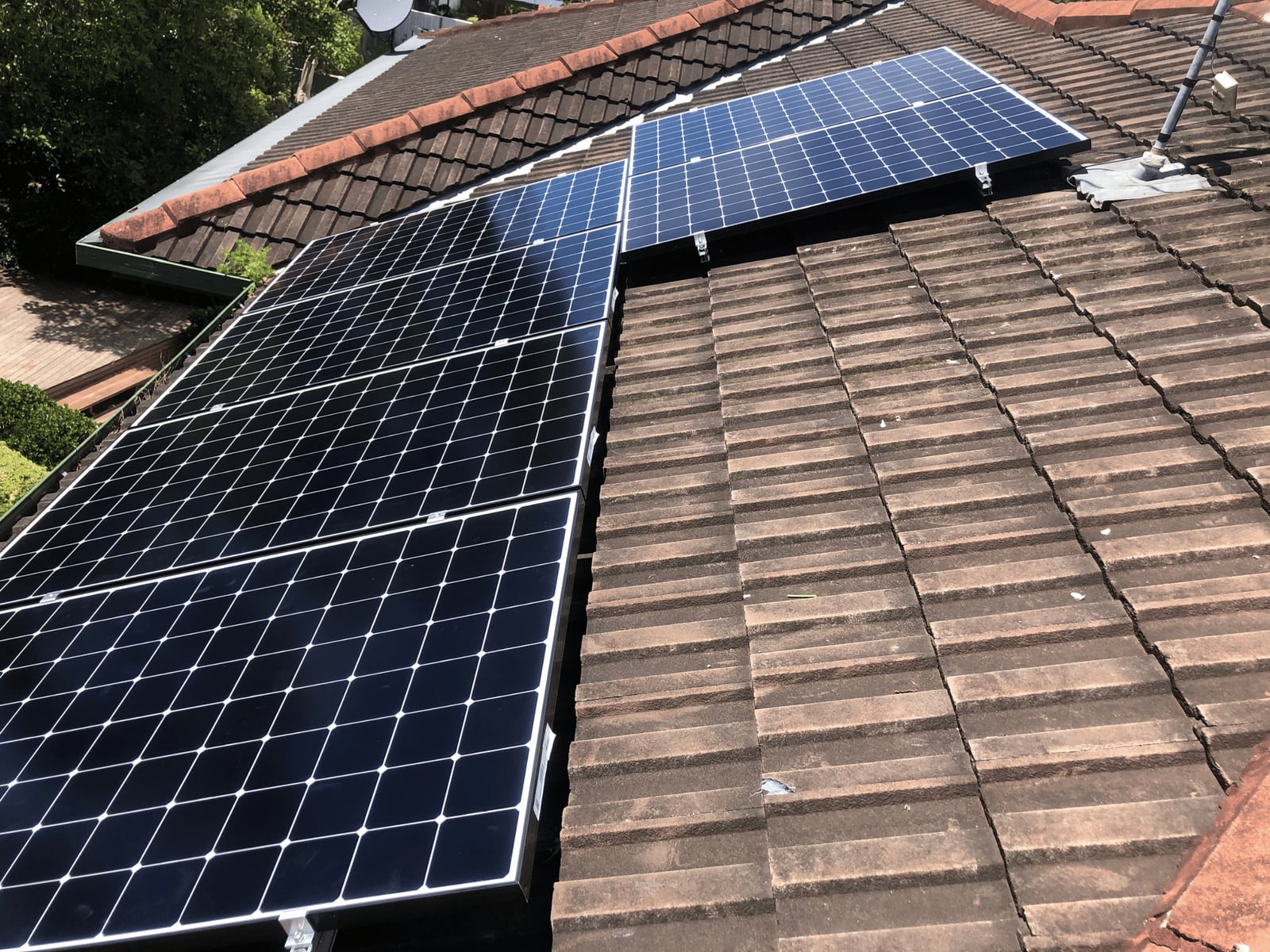 Solar panel array installed on a tiled roof